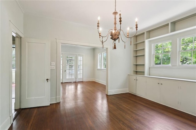 1665 Dufossat St, New Orleans, LA 70115 - unfurnished dining area with a chandelier, dark wood finished floors, baseboards, and ornamental molding