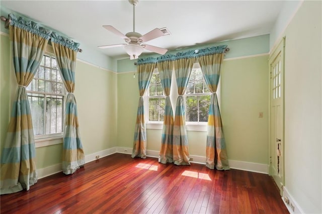 1665 Dufossat St, New Orleans, LA 70115 - empty room featuring wood-type flooring, a ceiling fan, and baseboards