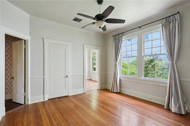 1665 Dufossat St, New Orleans, LA 70115 - unfurnished bedroom featuring wood finished floors, baseboards, and ceiling fan