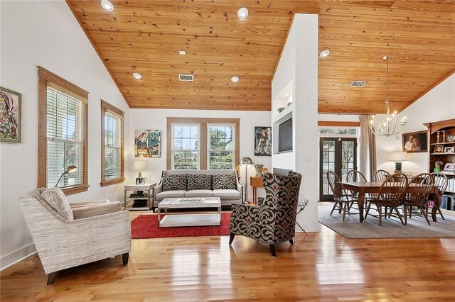 602 Jefferson Ave, New Orleans, LA 70115 - living room with wood ceiling, wood finished floors, a chandelier, french doors, and recessed lighting