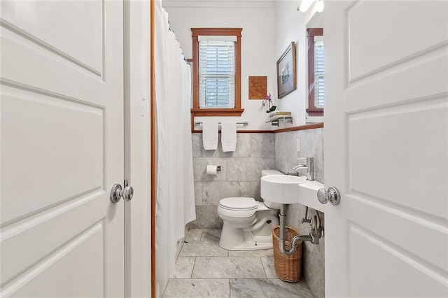 602 Jefferson Ave, New Orleans, LA 70115 - full bathroom with toilet, tile walls, a sink, tile patterned flooring, and a shower with curtain
