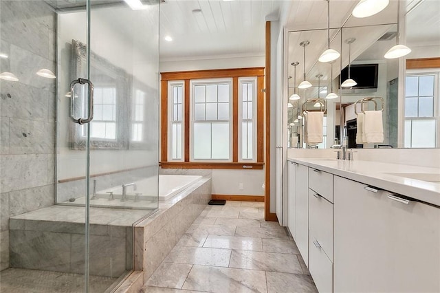 602 Jefferson Ave, New Orleans, LA 70115 - full bath featuring healthy amount of natural light, a stall shower, a bath, double vanity, and crown molding
