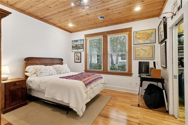 602 Jefferson Ave, New Orleans, LA 70115 - bedroom featuring wood ceiling, light wood-style flooring, baseboards, recessed lighting, and crown molding