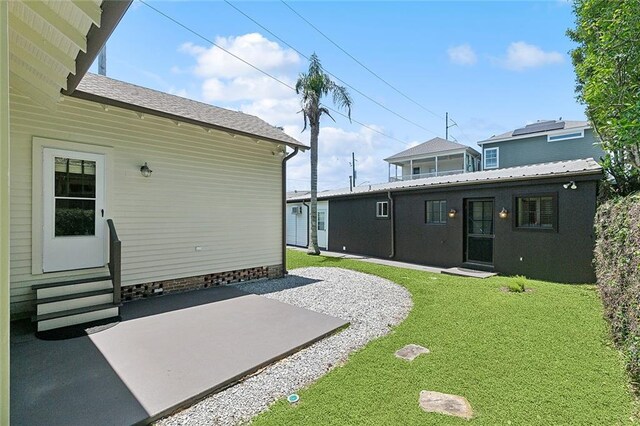 602 Jefferson Ave, New Orleans, LA 70115 - view of grassy yard featuring entry steps and a patio