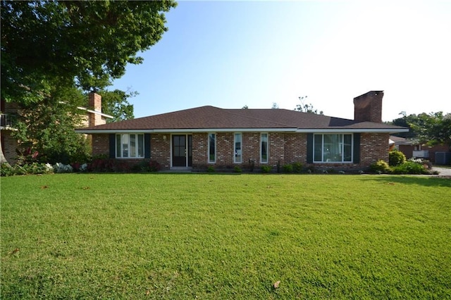 102 Apple Ct, Luling, LA 70070 - single story home with a front yard, a chimney, and brick siding