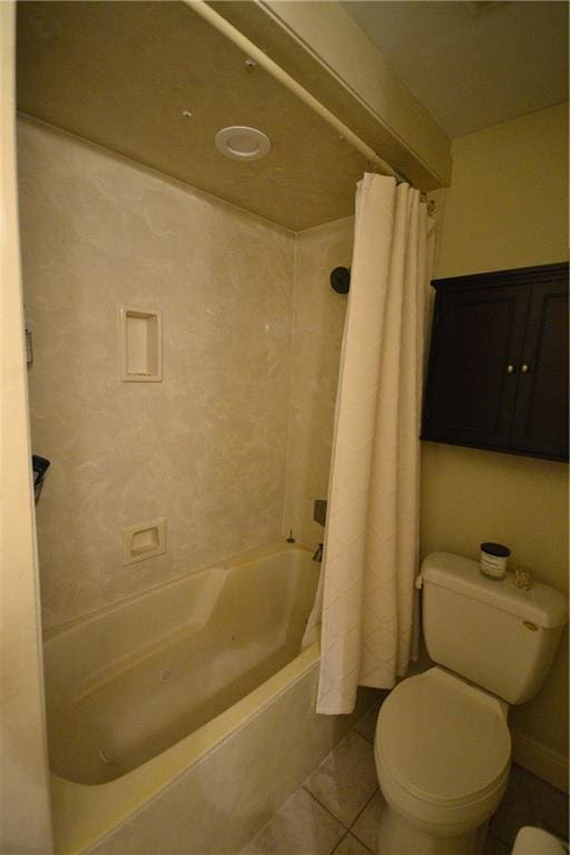 102 Apple Ct, Luling, LA 70070 - bathroom featuring shower / bath combo with shower curtain, toilet, and tile patterned floors