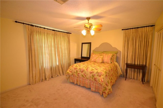 102 Apple Ct, Luling, LA 70070 - carpeted bedroom featuring ceiling fan, a textured ceiling, and a closet
