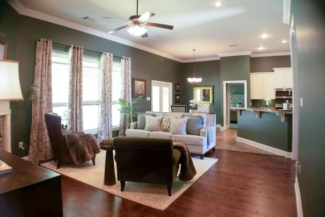 43357 Quiet Lake Dr, Hammond, LA 70403 - living area featuring ceiling fan, a chandelier, recessed lighting, dark wood finished floors, and crown molding