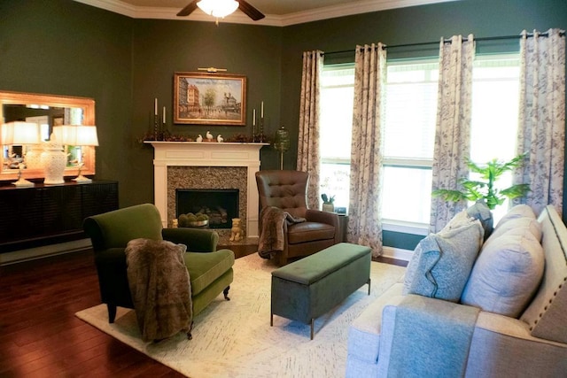 43357 Quiet Lake Dr, Hammond, LA 70403 - living room featuring crown molding, wood finished floors, ceiling fan, and a premium fireplace