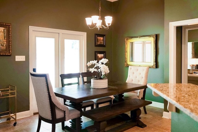 43357 Quiet Lake Dr, Hammond, LA 70403 - dining space with healthy amount of natural light, a chandelier, baseboards, and light tile patterned flooring