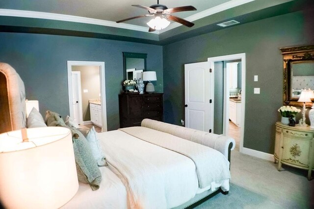 43357 Quiet Lake Dr, Hammond, LA 70403 - bedroom with light carpet, ensuite bathroom, ceiling fan, baseboards, and ornamental molding