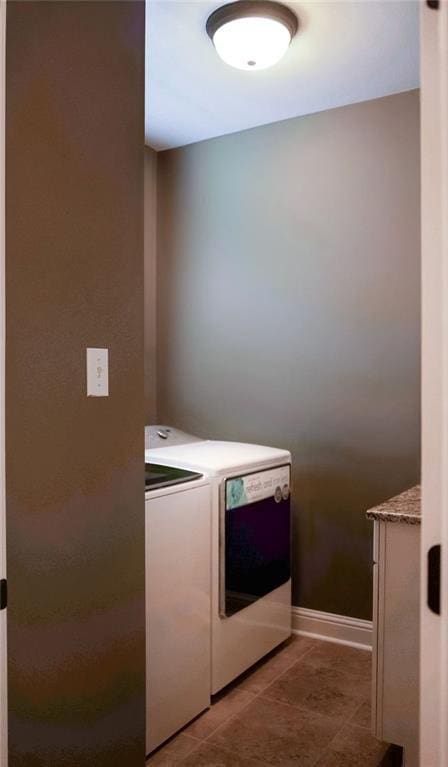 43357 Quiet Lake Dr, Hammond, LA 70403 - laundry room with washer and dryer, baseboards, and light tile patterned flooring