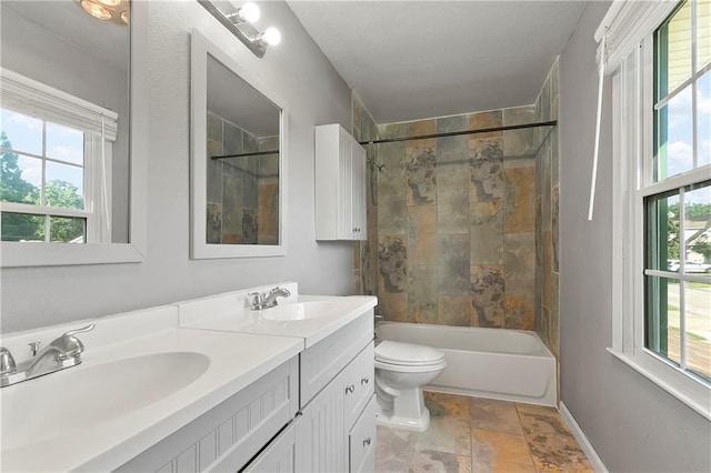 312 Tamarack St, Gretna, LA 70056 - full bathroom featuring double vanity, plenty of natural light, and toilet