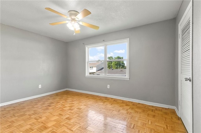 312 Tamarack St, Gretna, LA 70056 - unfurnished bedroom with baseboards, a textured ceiling, a closet, and a ceiling fan