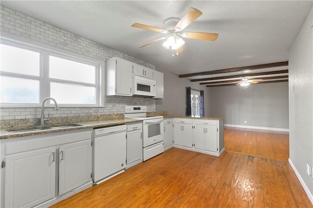 312 Tamarack St, Gretna, LA 70056 - kitchen featuring white appliances, a sink, backsplash, ceiling fan, and beam ceiling