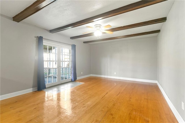 312 Tamarack St, Gretna, LA 70056 - unfurnished room featuring wood finished floors, beam ceiling, baseboards, and a ceiling fan