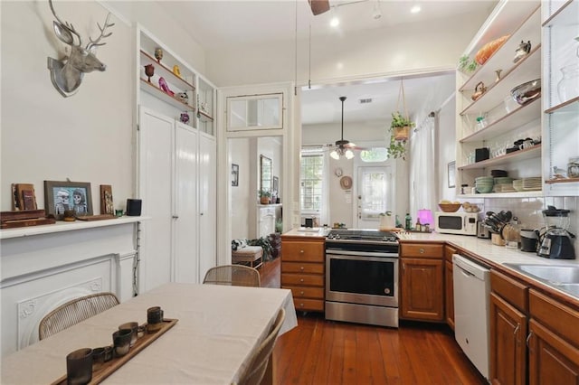921-23 Hagan Ave, New Orleans, LA 70119 - kitchen featuring white appliances, ceiling fan, open shelves, brown cabinets, and tile countertops