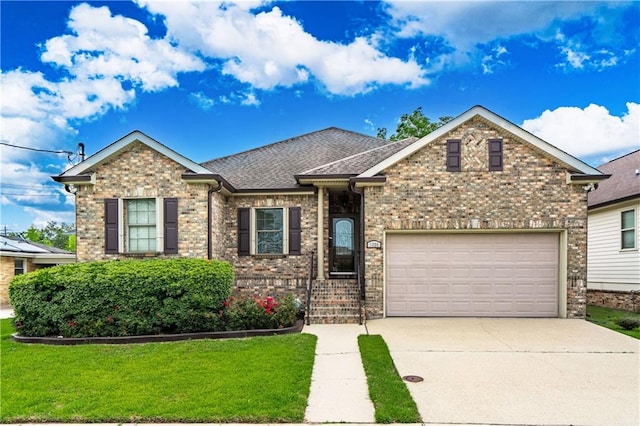 1326 Prentiss Ave, New Orleans, LA 70122 - view of front of house with driveway, a front lawn, brick siding, and a garage