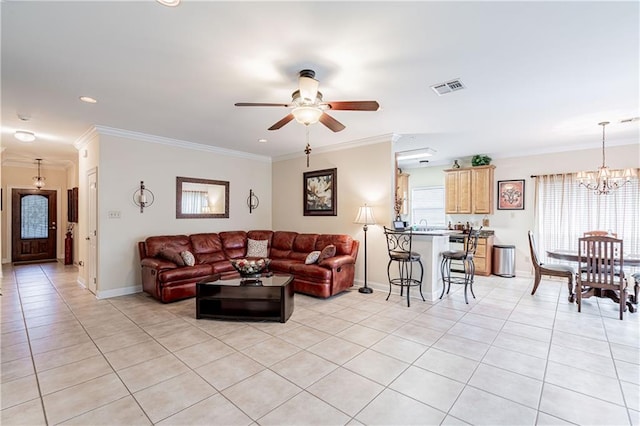 1326 Prentiss Ave, New Orleans, LA 70122 - living room with light tile patterned floors, a ceiling fan, ornamental molding, baseboards, and a chandelier