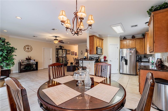 1326 Prentiss Ave, New Orleans, LA 70122 - dining space with light tile patterned floors, ceiling fan, crown molding, a chandelier, and recessed lighting
