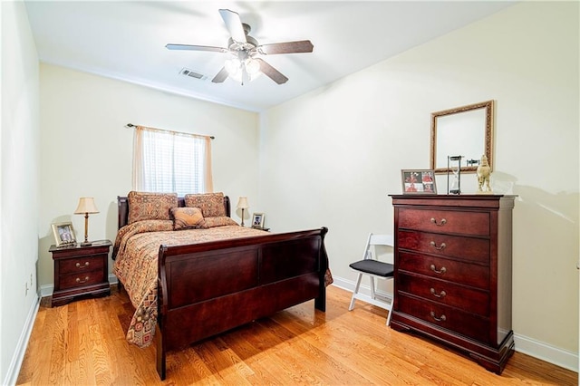 1326 Prentiss Ave, New Orleans, LA 70122 - bedroom with wood finished floors, baseboards, and a ceiling fan