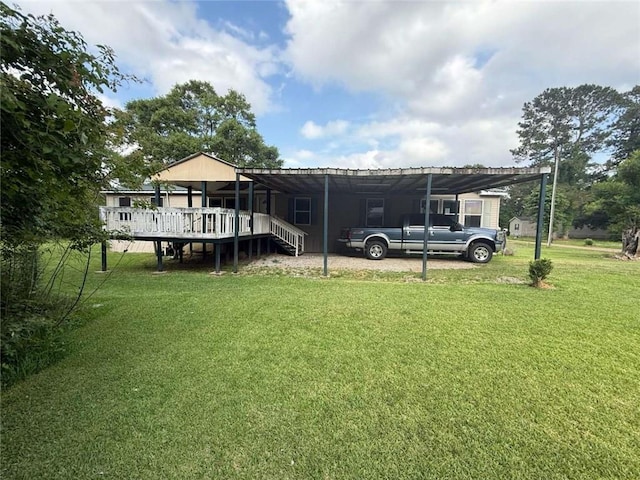 201 Sparrow St, New Iberia, LA 70563 - view of grassy yard featuring a deck and a carport
