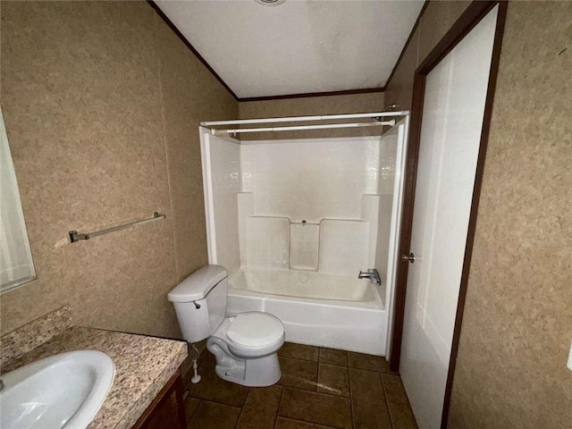 201 Sparrow St, New Iberia, LA 70563 - bathroom with vanity, toilet, tub / shower combination, tile patterned flooring, and ornamental molding