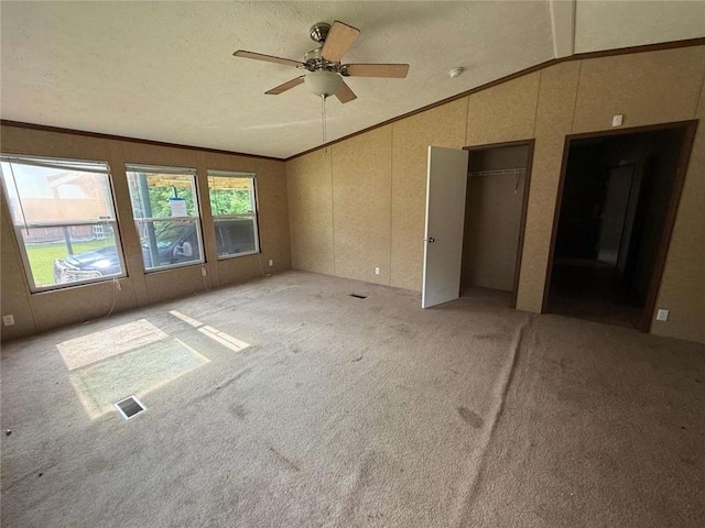 201 Sparrow St, New Iberia, LA 70563 - unfurnished living room featuring vaulted ceiling, a ceiling fan, light colored carpet, and ornamental molding