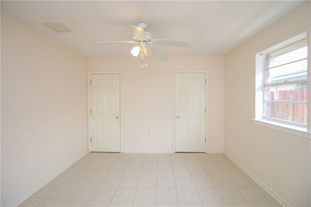 2804 Transcontinental Dr, Metairie, LA 70006 - empty room featuring a ceiling fan, plenty of natural light, and baseboards
