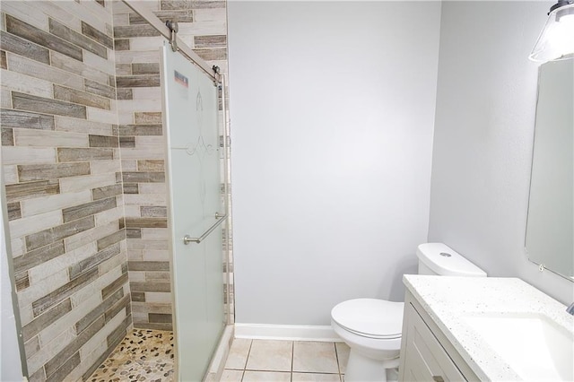 2804 Transcontinental Dr, Metairie, LA 70006 - full bath with toilet, a shower stall, vanity, tile patterned flooring, and baseboards