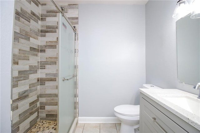 2804 Transcontinental Dr, Metairie, LA 70006 - bathroom featuring a shower stall, vanity, toilet, and tile patterned flooring