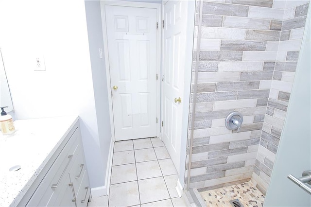 2804 Transcontinental Dr, Metairie, LA 70006 - full bath with a stall shower, vanity, tile patterned flooring, and baseboards