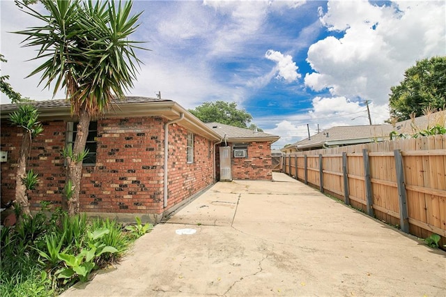 2804 Transcontinental Dr, Metairie, LA 70006 - view of home's exterior featuring brick siding and a patio