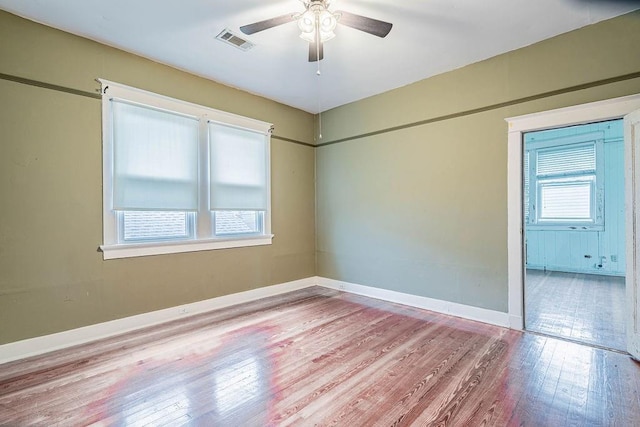 606 Filmore St, New Orleans, LA 70124 - unfurnished room with wood finished floors, a ceiling fan, and baseboards