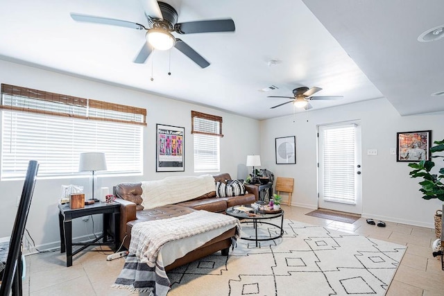 606 Filmore St, New Orleans, LA 70124 - living room with a ceiling fan, healthy amount of natural light, and light tile patterned floors