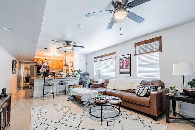 606 Filmore St, New Orleans, LA 70124 - living room featuring ceiling fan and light tile patterned flooring