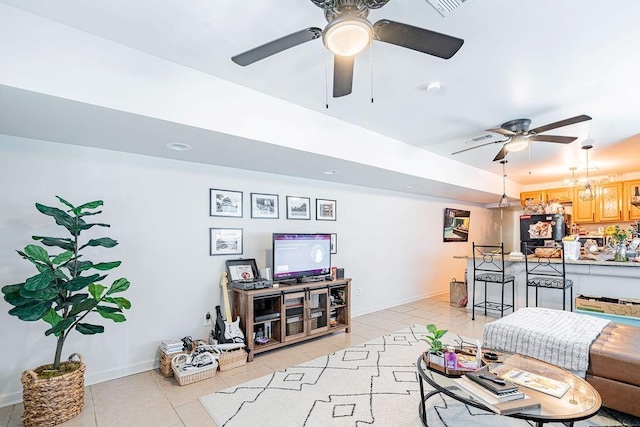 606 Filmore St, New Orleans, LA 70124 - living room with a ceiling fan, light tile patterned flooring, and baseboards