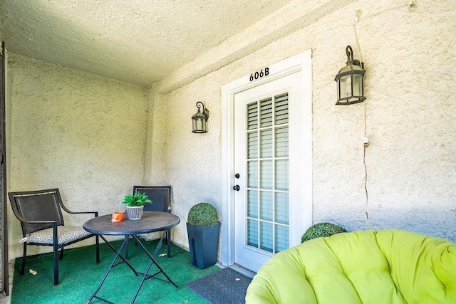 606 Filmore St, New Orleans, LA 70124 - doorway to property with stucco siding