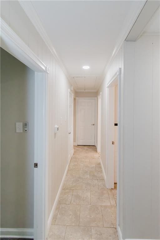 1801 River Oaks Dr, New Orleans, LA 70131 - corridor with light stone finish floors, baseboards, attic access, a decorative wall, and ornamental molding