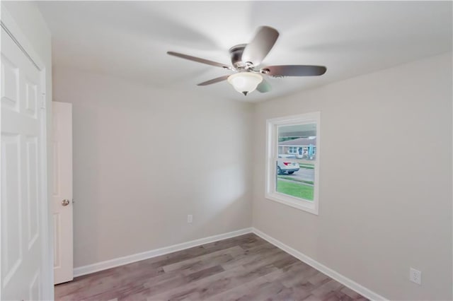 1801 River Oaks Dr, New Orleans, LA 70131 - spare room featuring ceiling fan, wood finished floors, and baseboards