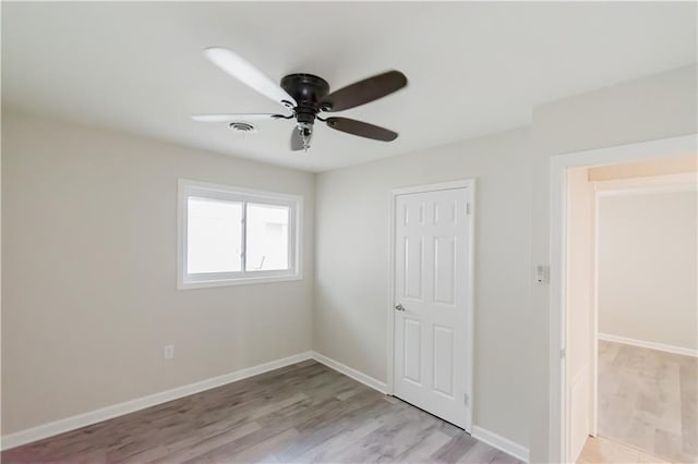 1801 River Oaks Dr, New Orleans, LA 70131 - unfurnished bedroom featuring light wood finished floors, baseboards, and a ceiling fan
