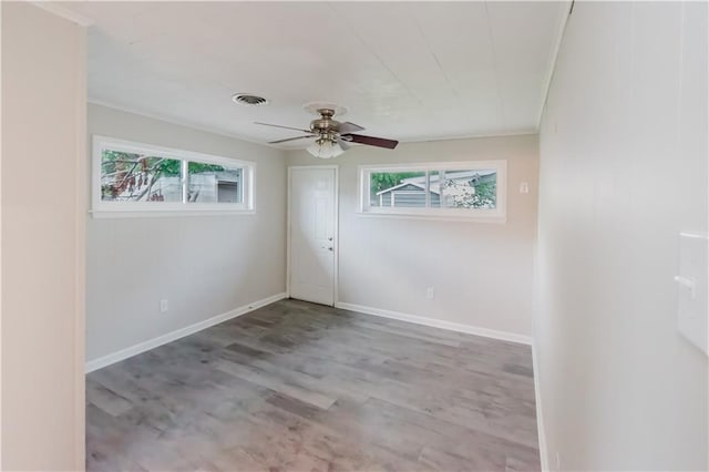 1801 River Oaks Dr, New Orleans, LA 70131 - spare room with a ceiling fan, wood finished floors, crown molding, and baseboards
