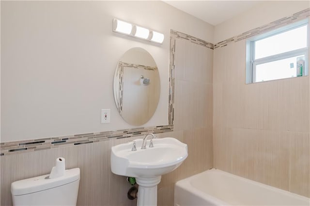 1801 River Oaks Dr, New Orleans, LA 70131 - full bathroom with tile walls, toilet, and  shower combination