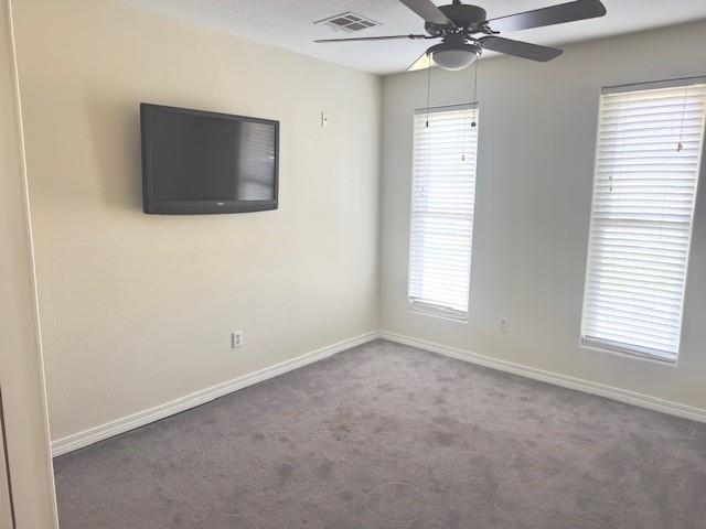 4231 San Trovaso St, New Orleans, LA 70129 - empty room featuring ceiling fan, carpet, and plenty of natural light