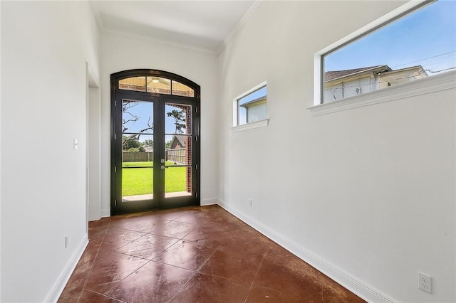 155 Sauve Rd, River Ridge, LA 70123 - entryway with ornamental molding, baseboards, tile patterned flooring, and french doors