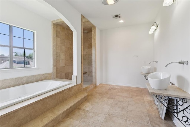 155 Sauve Rd, River Ridge, LA 70123 - bathroom with a bath, double vanity, a tile shower, and baseboards