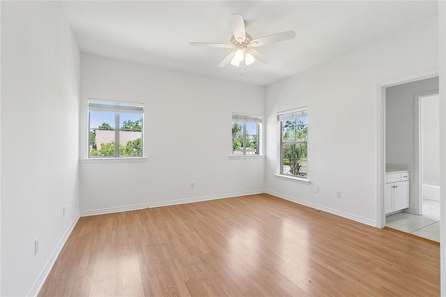 155 Sauve Rd, River Ridge, LA 70123 - spare room with light wood finished floors, ceiling fan, and baseboards