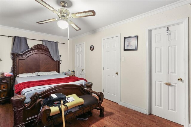 5833 N Oak Dr, Marrero, LA 70072 - bedroom with crown molding, wood finished floors, baseboards, and a ceiling fan