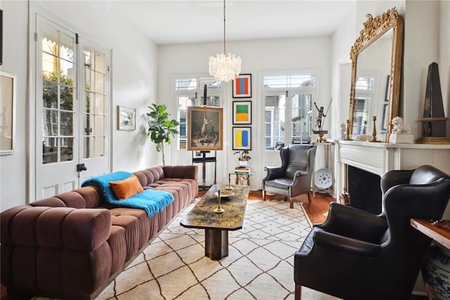 927 Dauphine St, New Orleans, LA 70116 - living area with plenty of natural light, a chandelier, and wood finished floors