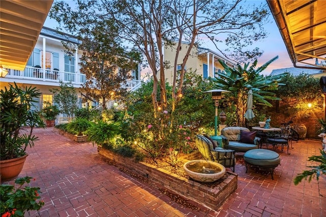 927 Dauphine St, New Orleans, LA 70116 - patio terrace at dusk with a patio